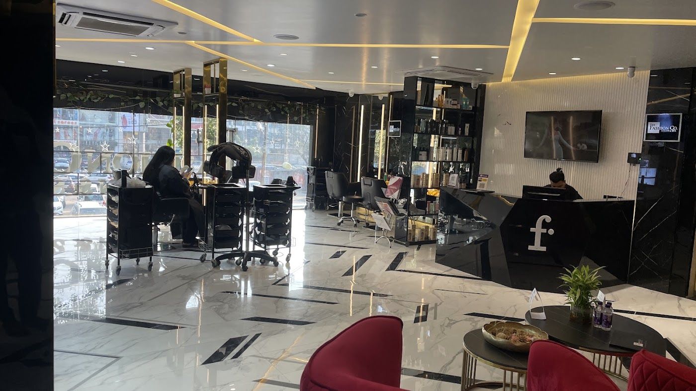 The salon floor with styling stations, mirrors and reception