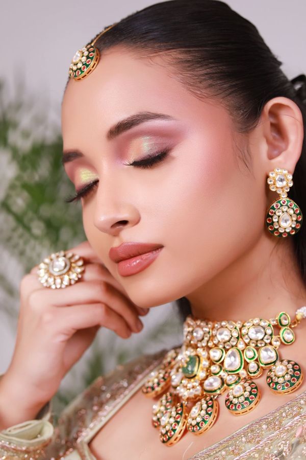 Soft glam makeup with statement jewellery