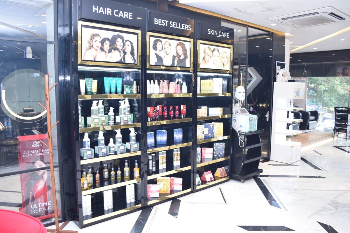 Hair care and skin care retail wall with L'Oréal and Wella products